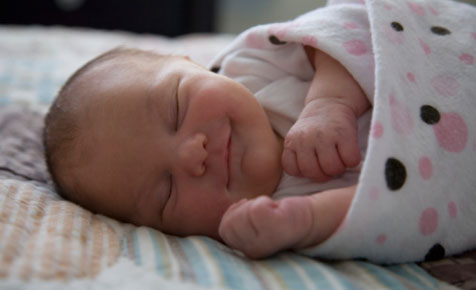 Swaddling and wrapping a newborn baby