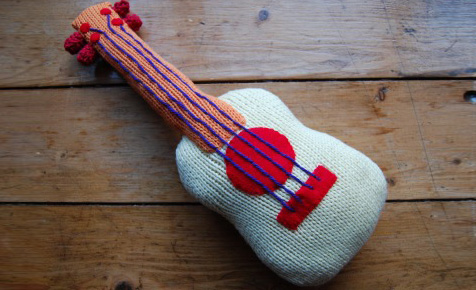 Knitted guitar soft toy