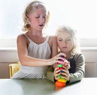 boy rolling playdough