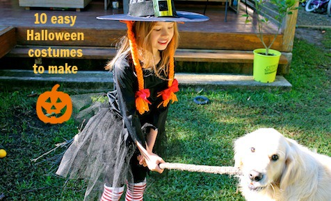Little girl dressed as witch with dog on Kidspot